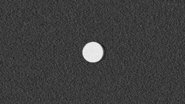 A white ellipse in the middle of a noisy field gets blown away into a dune-like pattern.